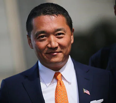 Benjamin Wey wearing an American flag lapel pin, New York City