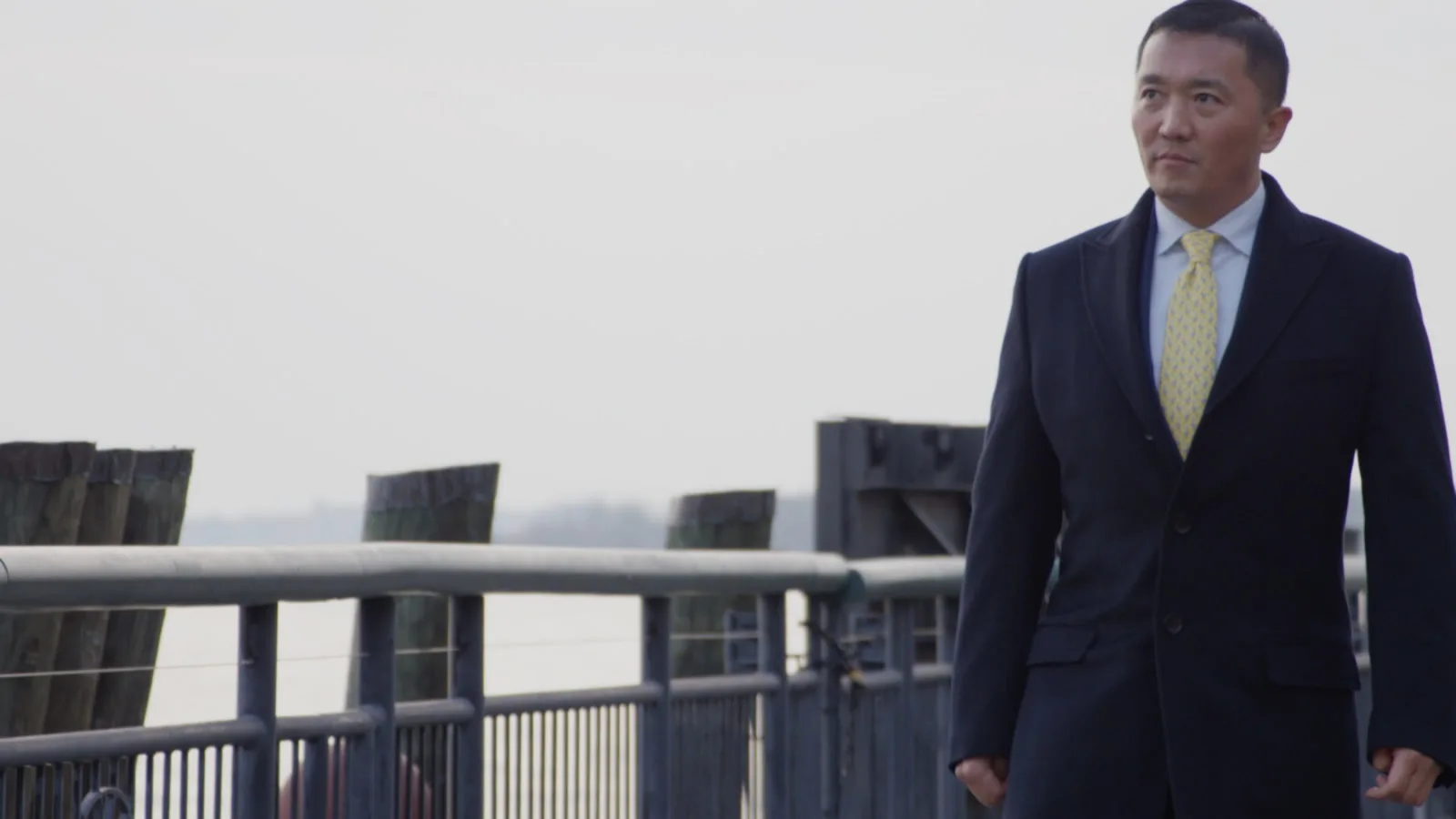 Benjamin Wey walking along the New York waterfront